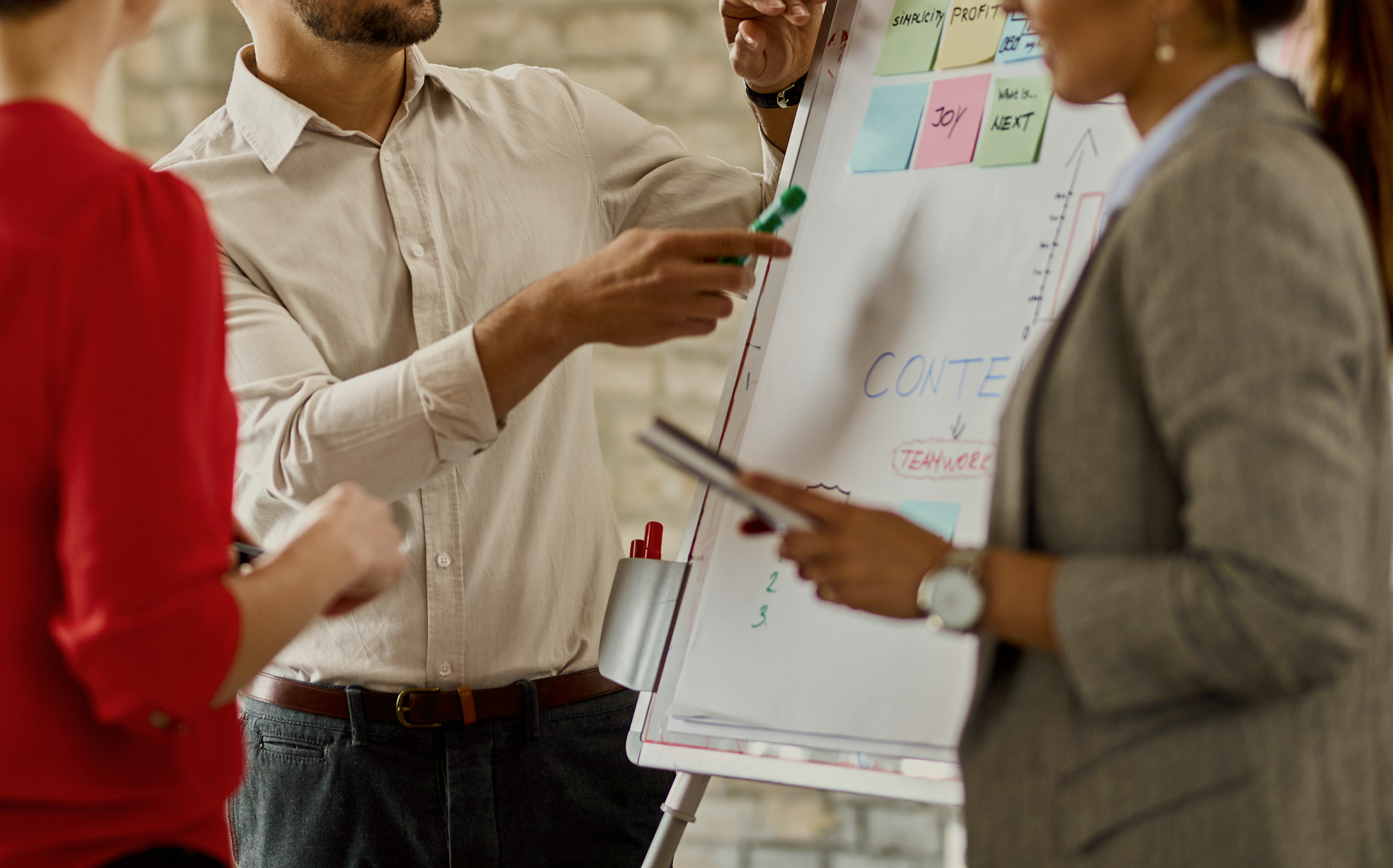 Team collaborating around a whiteboard during a planning session